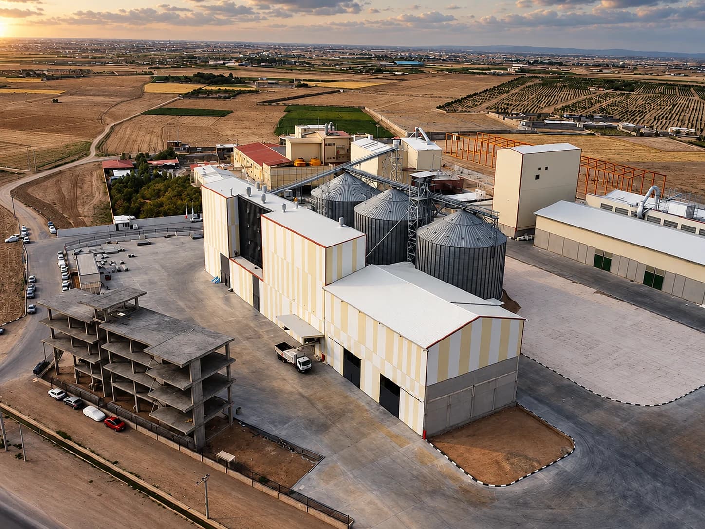 Aerial view of the mill building, silos and storage yard